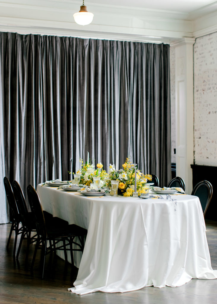 Indoor black and yellow wedding reception tablescape